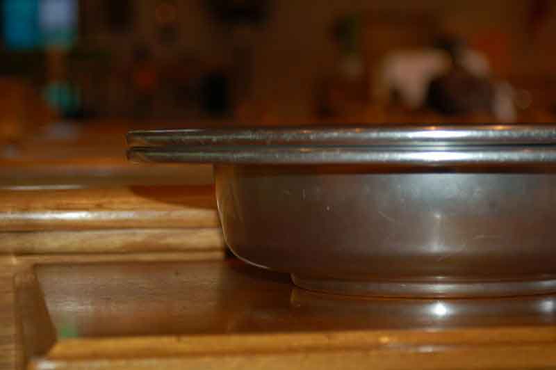Closeup of an offering plate.